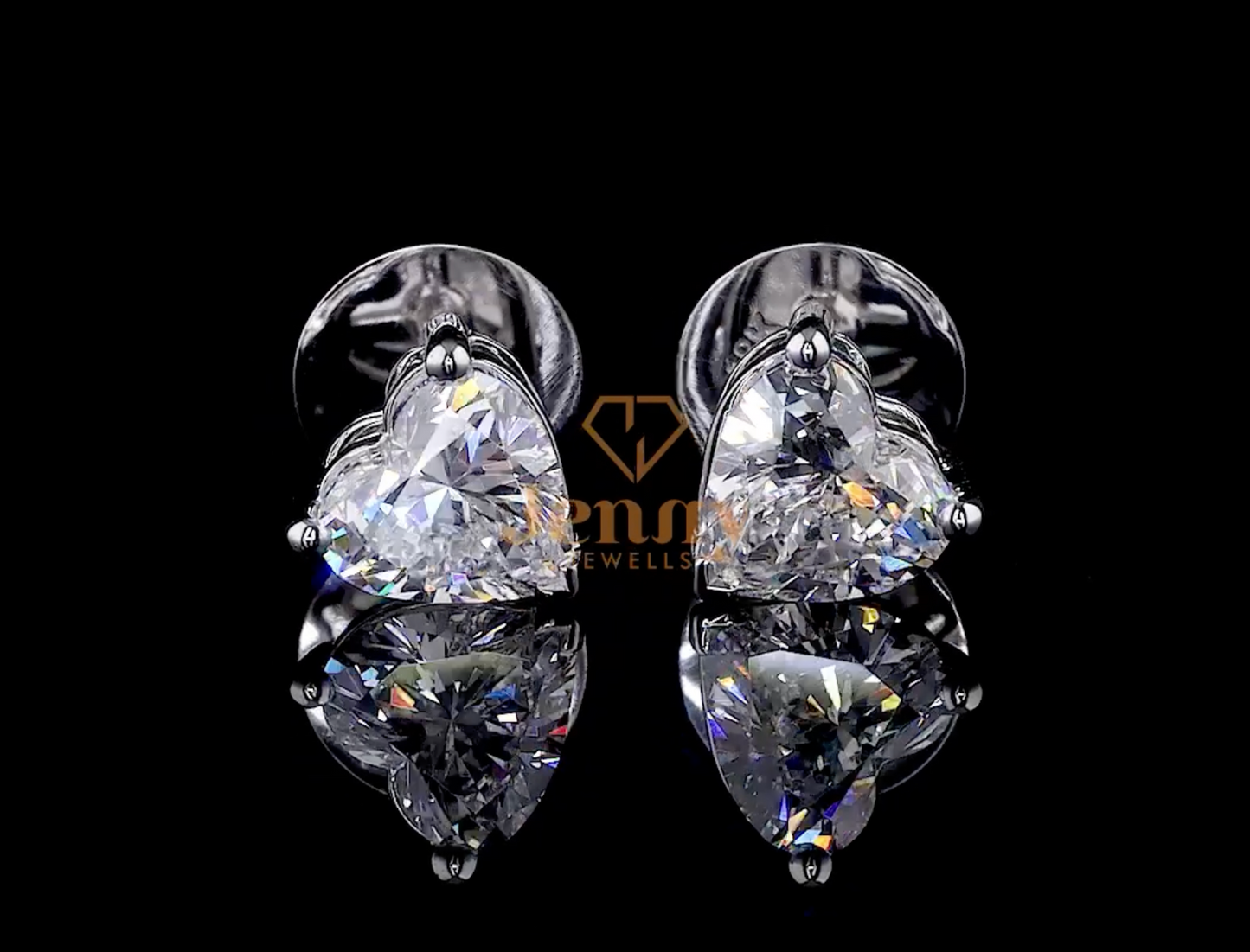Heart Diamond Halo Earrings with a 2CT heart-shaped diamond and round diamond halo, set in white, yellow, or rose gold. A romantic and elegant jewelry piece.