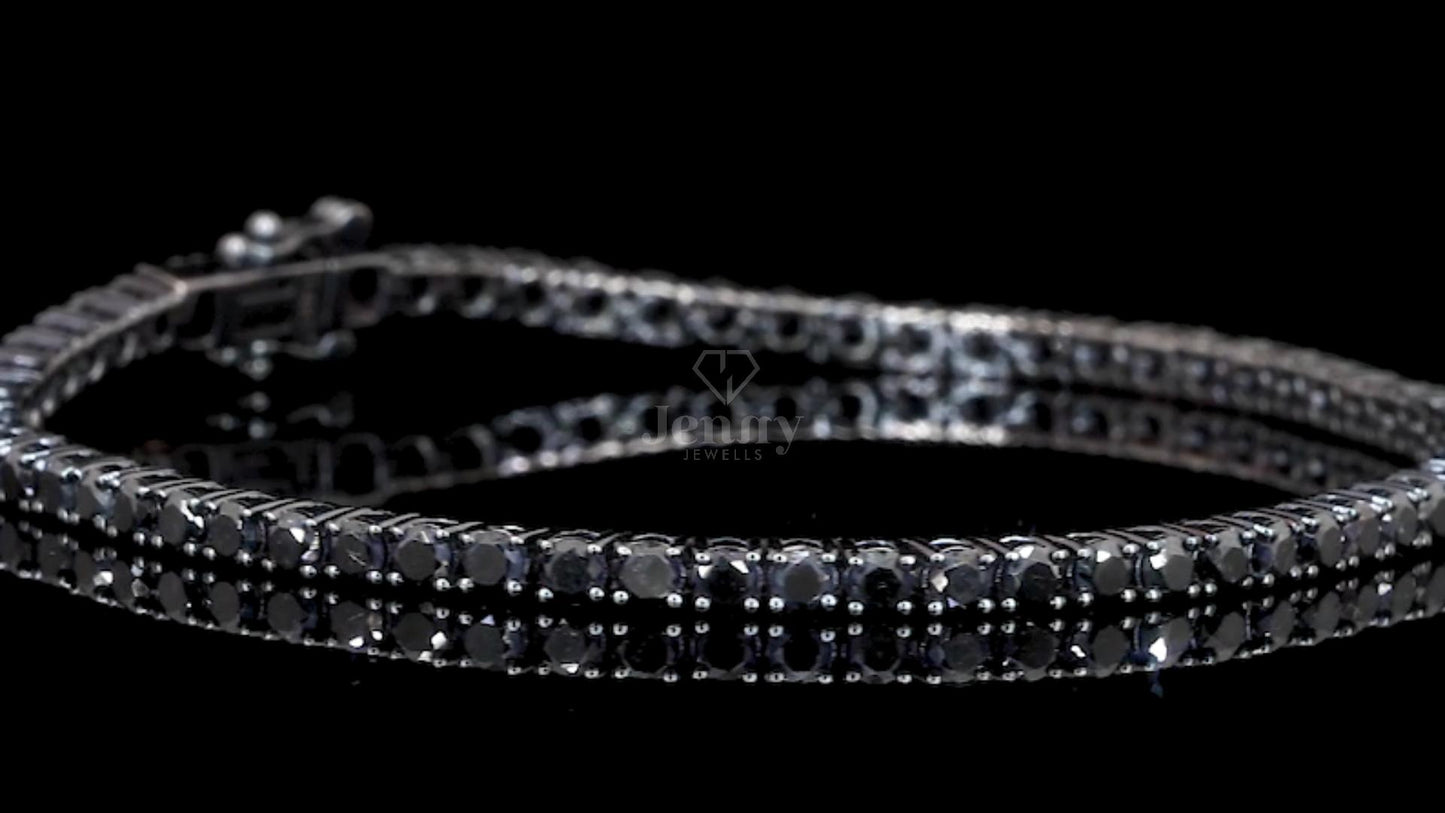Close-up detailing of 62 natural black diamonds on a tennis bracelet