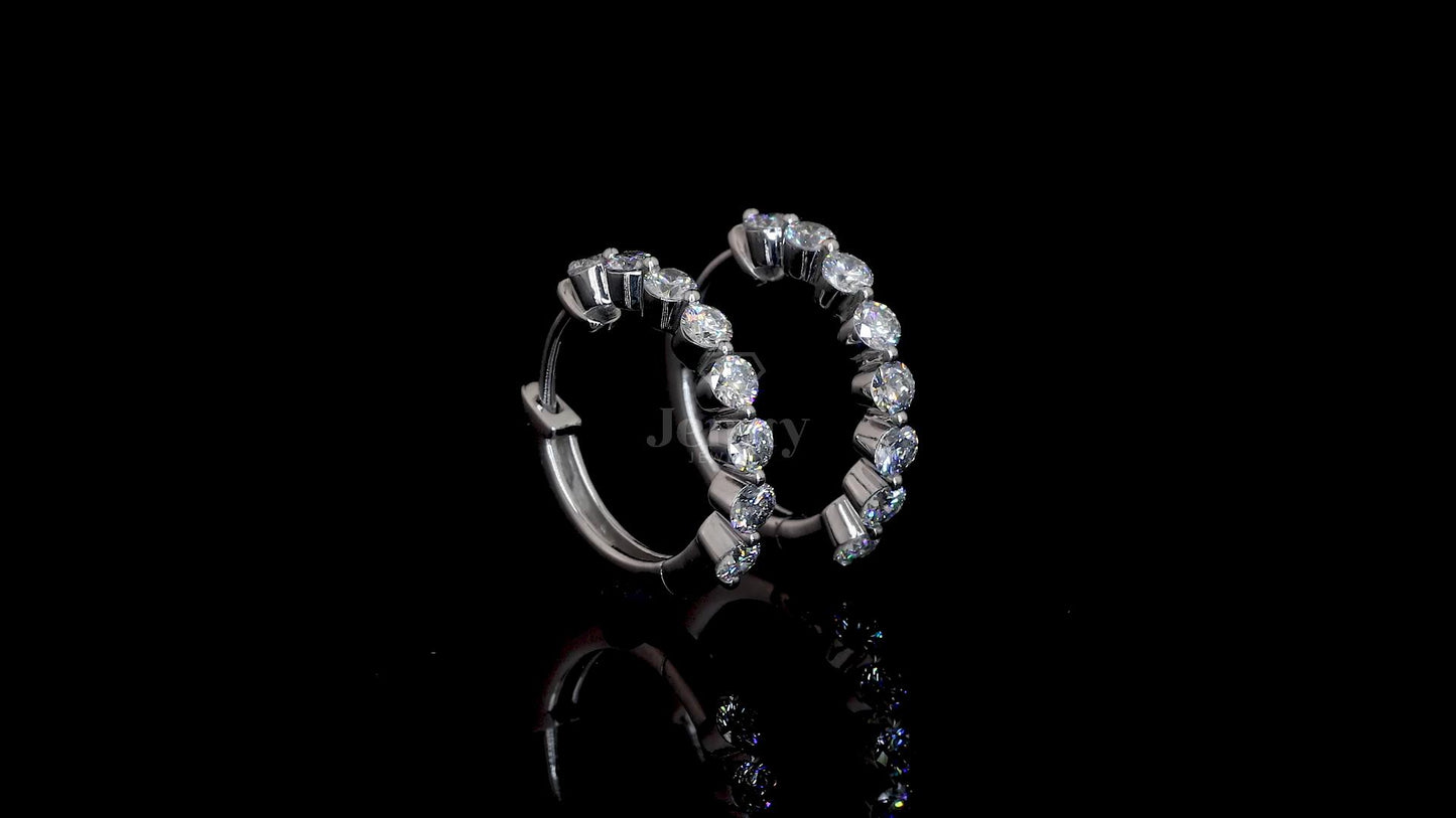 Close-up of 1.60 carat lab-grown diamond hoop earrings with 16 round brilliant diamonds set in polished gold by Jenny Jewells
