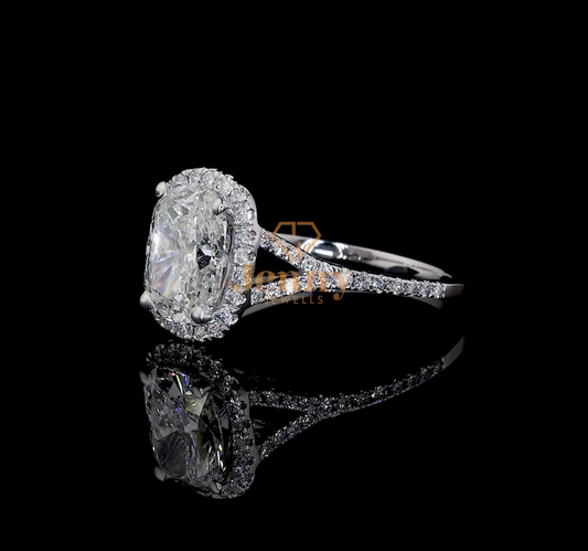 Cushion-cut diamond ring with a round halo setting, elegantly crafted in white, yellow, or rose gold for a timeless and luxurious appeal.