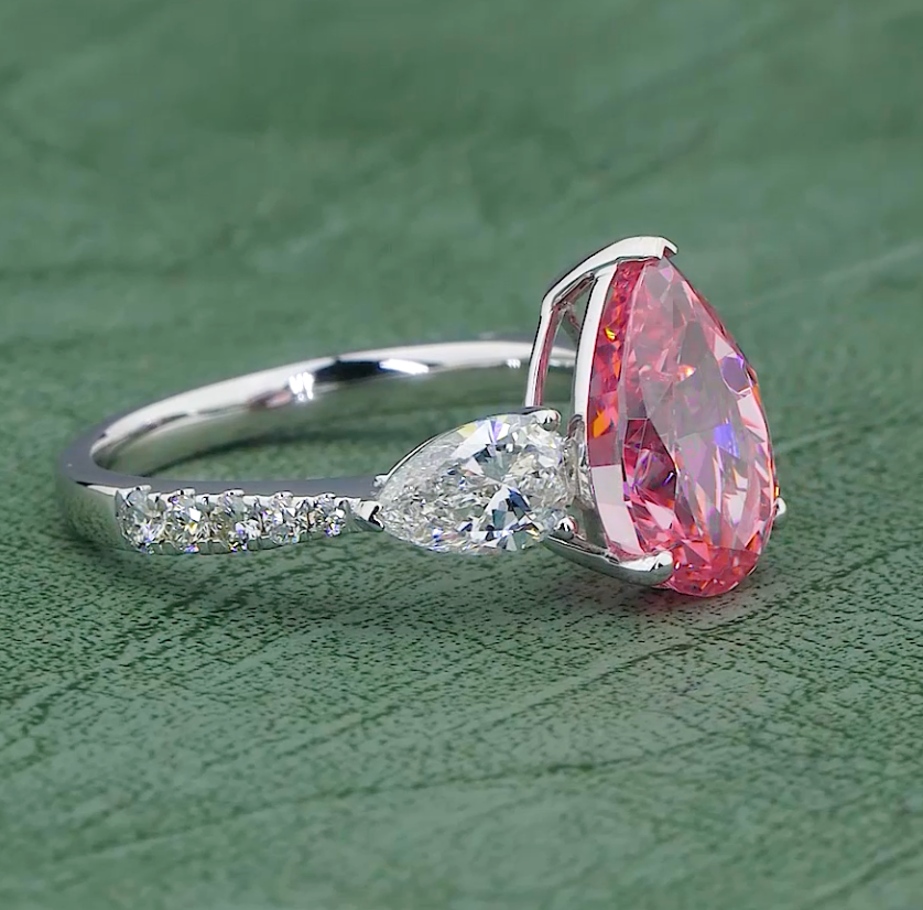 6.58 CT Ice Pink Pear Cut Lab Grown Diamond Ring | 8.08 CT E-F VVS Three Stone Ring | Jenny Jewells