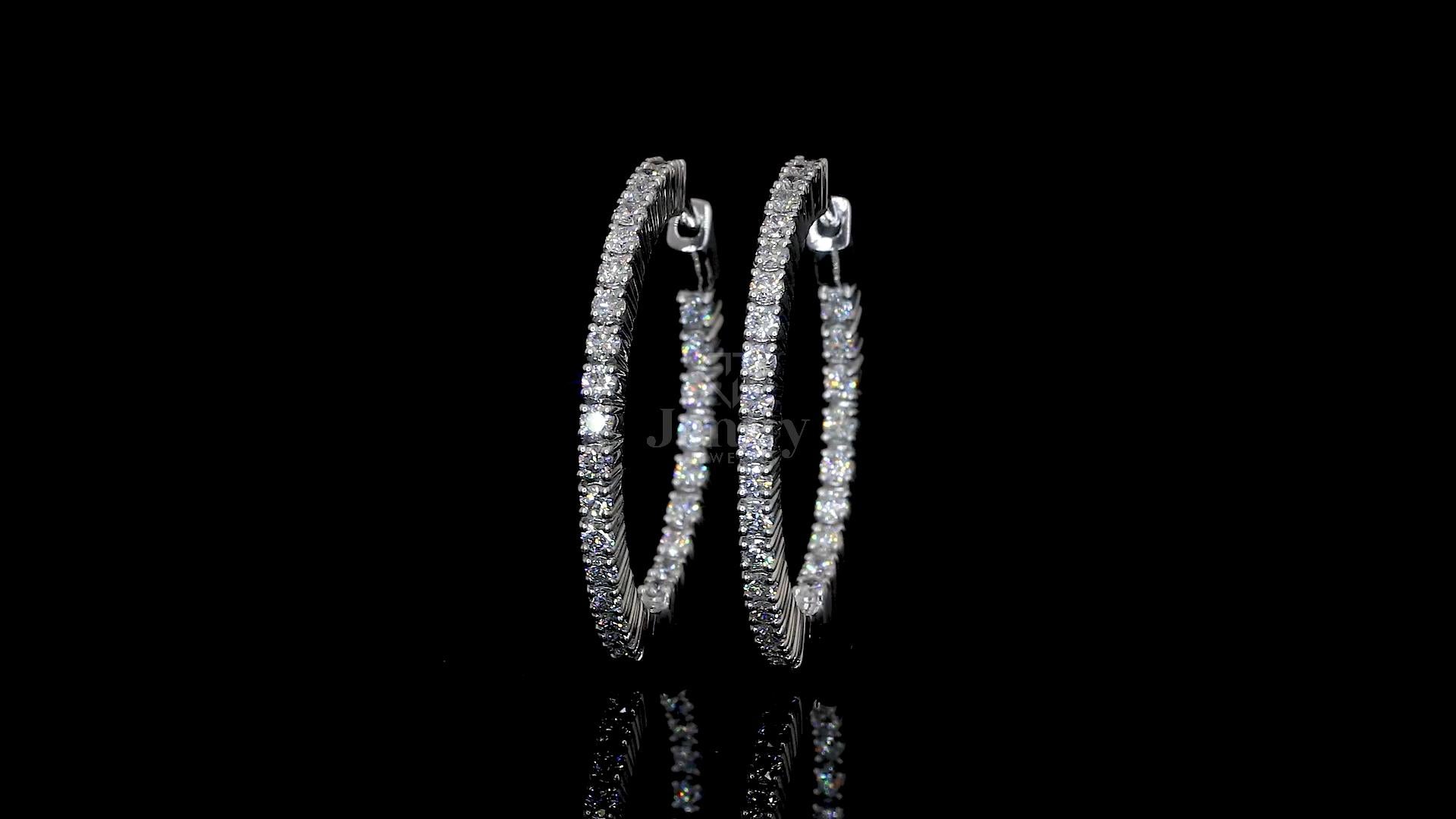Close-up of 56 finely set lab-grown diamonds on bangle-style hoop earrings