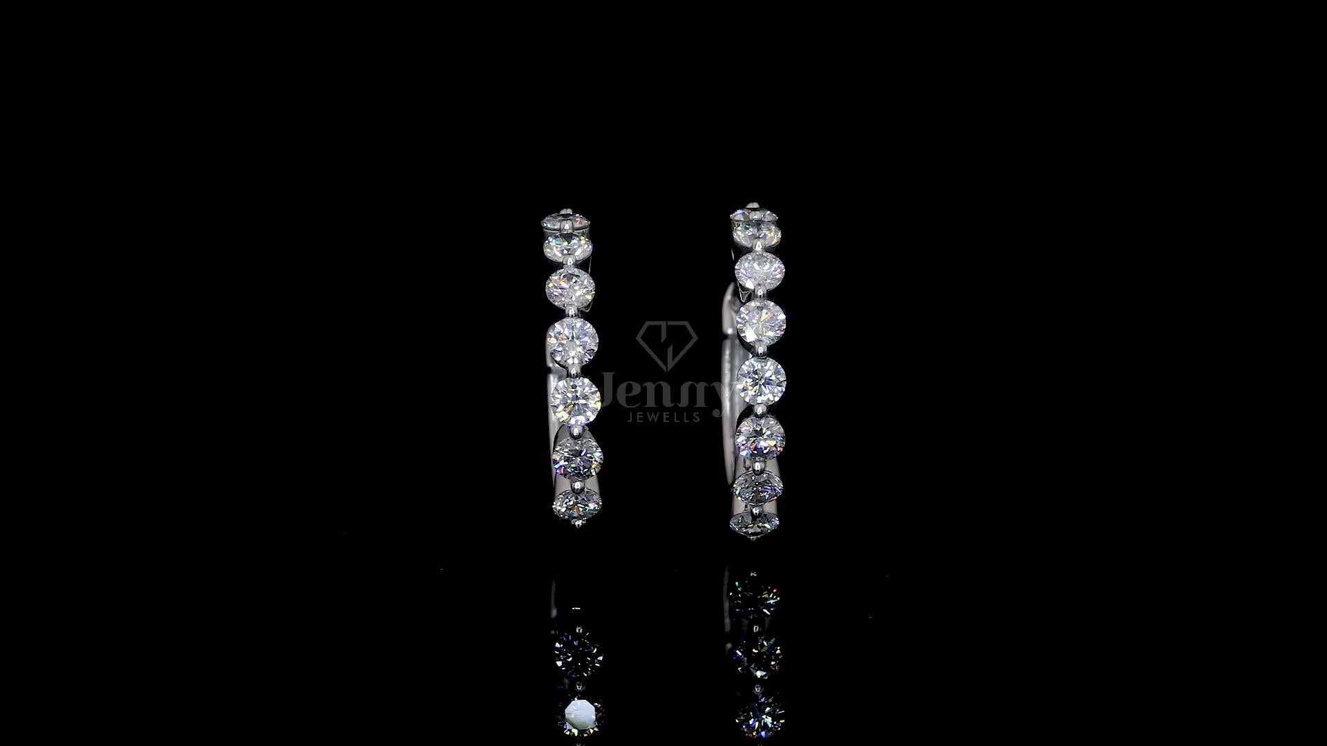 Elegant lab-grown diamond hoop earrings in white gold featuring 16 round diamonds totaling 1.60 carats.