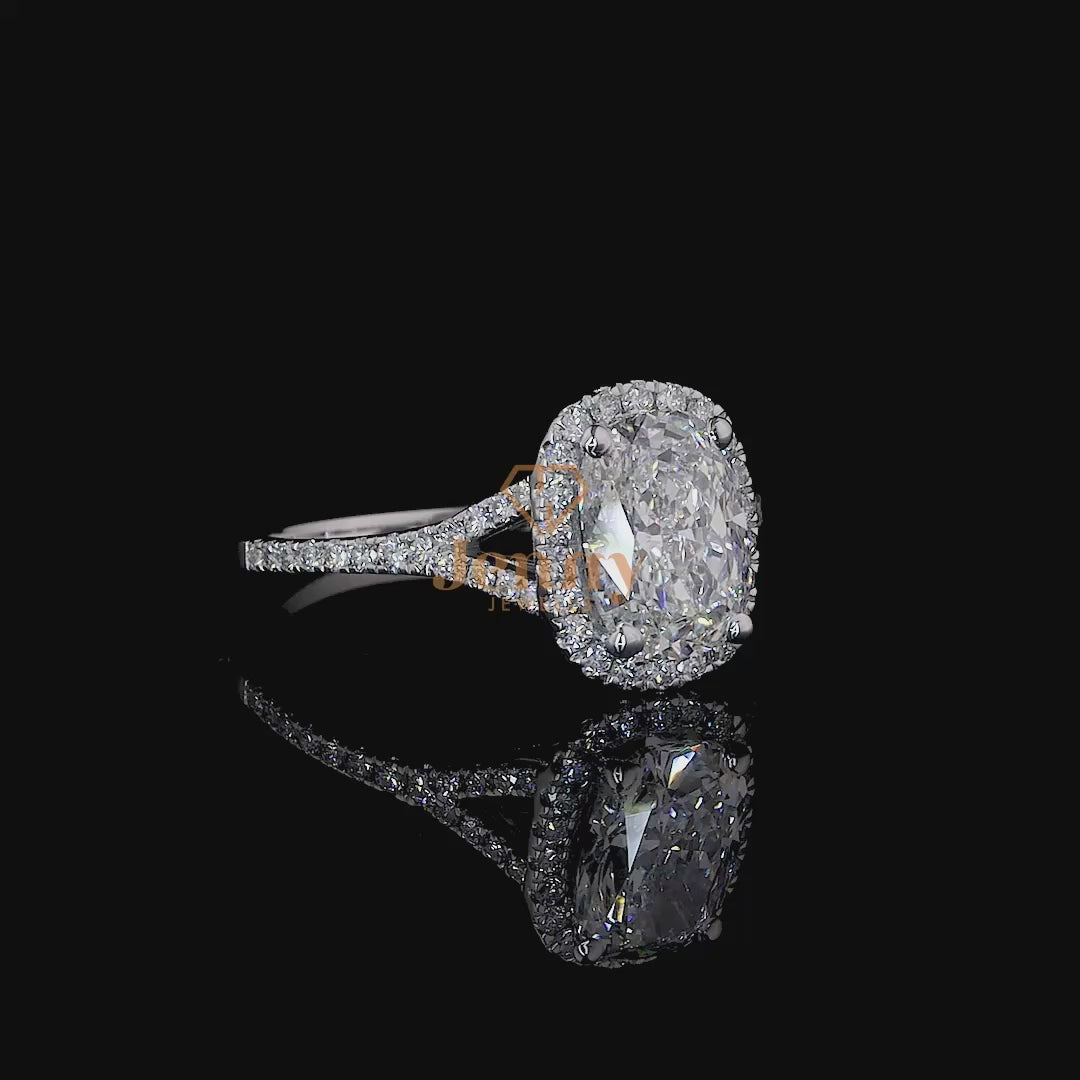 Cushion-cut diamond ring with a round halo setting, elegantly crafted in white, yellow, or rose gold for a timeless and luxurious appeal.