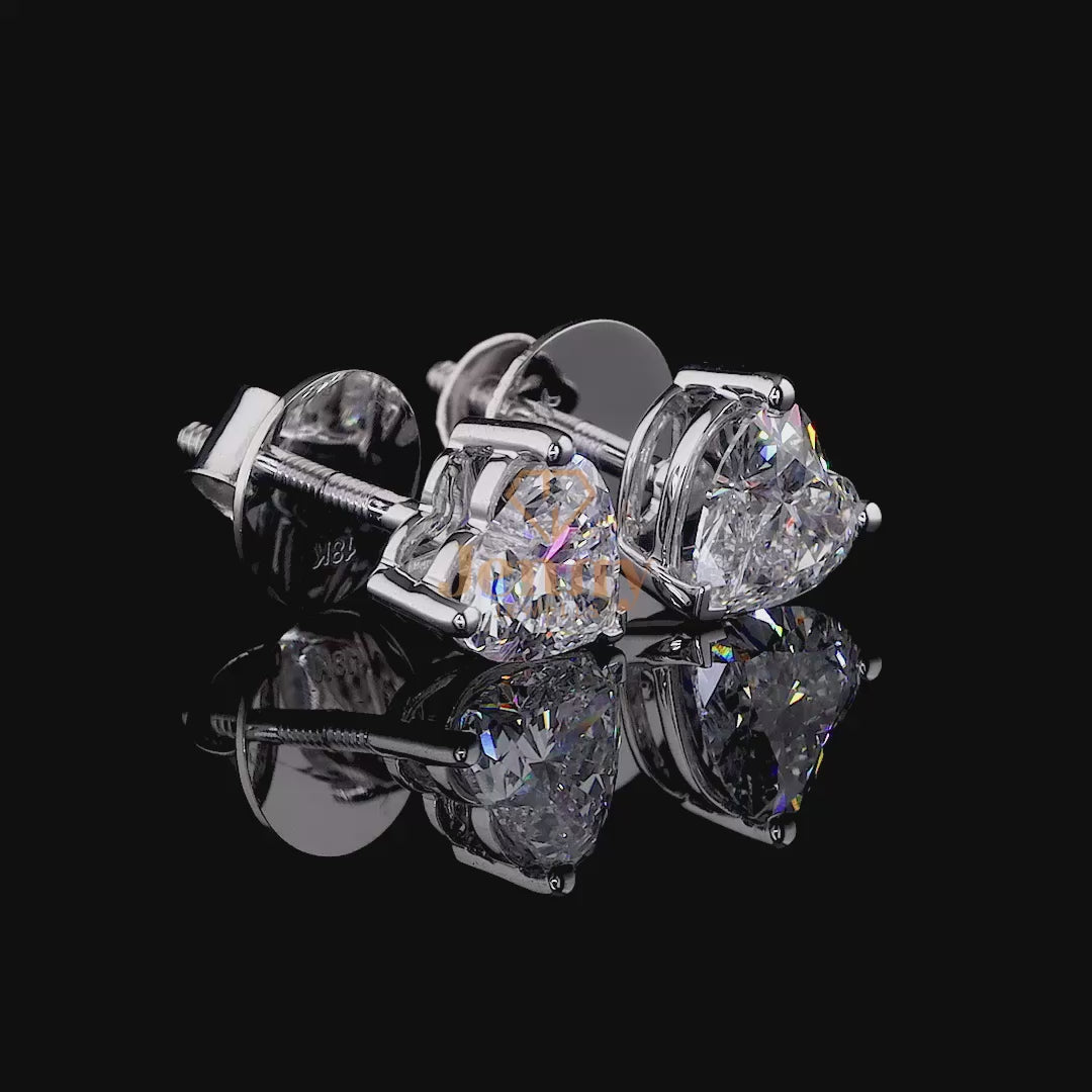 Heart Diamond Halo Earrings with a 2CT heart-shaped diamond and round diamond halo, set in white, yellow, or rose gold. A romantic and elegant jewelry piece.