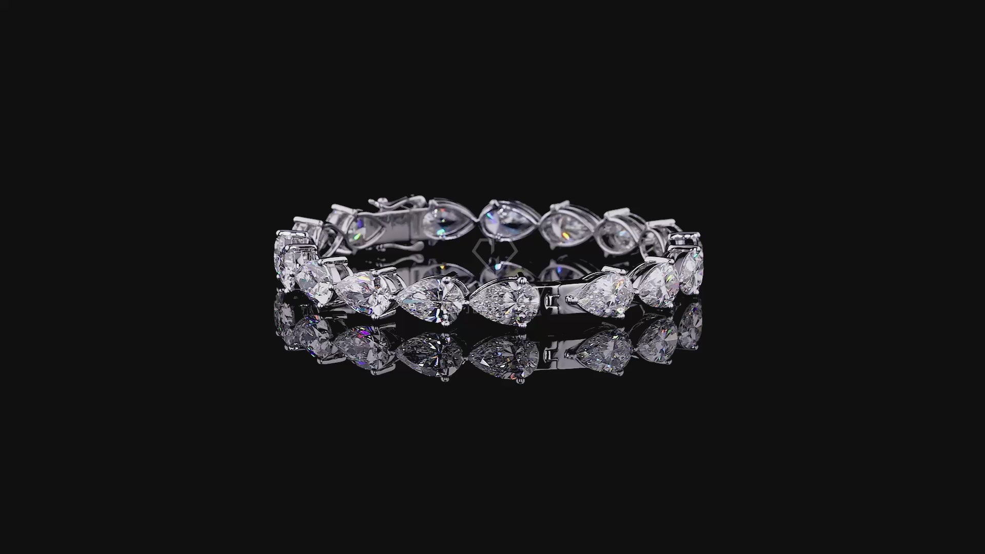 Elegant bangle featuring pear-cut stones set in a sleek, modern design.